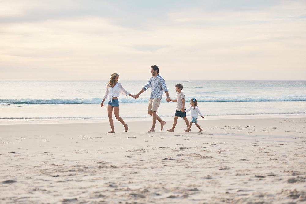 Family walking on the beach